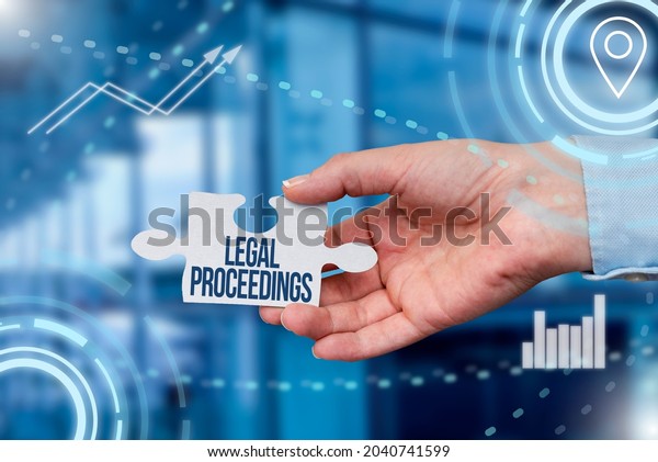 Sign\
displaying Legal Proceedings. Conceptual photo procedure instituted\
in a court of law to acquire benefit Hand Holding Jigsaw Puzzle\
Piece Unlocking New Futuristic\
Technologies.