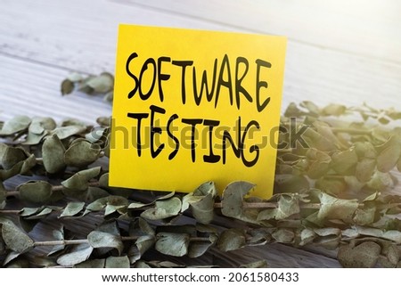 Sign displaying Software Testing. Business approach evaluate the functionality of a software application Blank Piece Of Sticky Note Placed On Top Of A Table Beside A Plant.