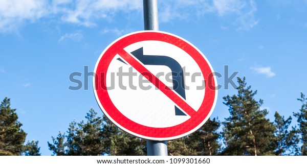 Sign do\
not turn left background of the sky and\
forest