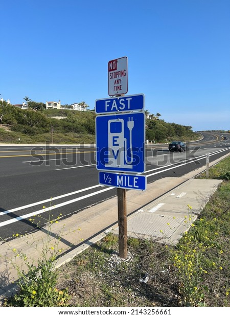 Sign for electric vehicle fast\
charging station along the Coast Highway in Southern\
California.