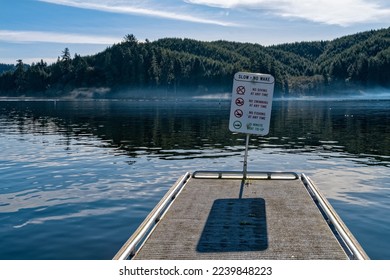 A sign at the end of a dock at Tenmile Lake in Lakeside, Oregon, USA - Powered by Shutterstock