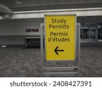 Sign in English and French Study Permits at Toronto International Pearson Airport with directional arrow showing a way to proceed for arriving international students.