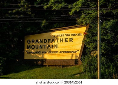 Sign entrance to Grandfather Mountain State Park in Banner Elk, North Carolina by Sugar Mountain ski resort with text for miles directions and top scenic attraction slogan