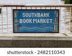 A sign at the famous Southbank Book Market, located on the South Bank in London, UK.