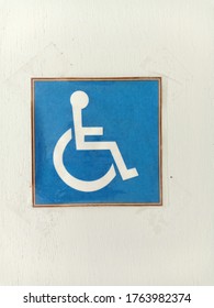 The Sign In Front Of The Bathroom Door For The Disabled