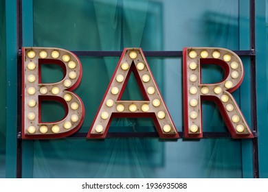 Sign with glowing letters showing word bar outside off tall office building at City of Zurich, Switzerland. - Powered by Shutterstock