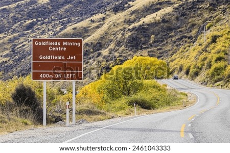 Sign for Goldfields Mining Centre and Jet on the Kawarau Gorge Road, State Highway 6, Otago, New Zealand. 