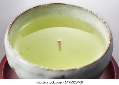 It is a sign of good luck to have a tea stalk floating erect in your tea. - Shutterstock ID 1495328408