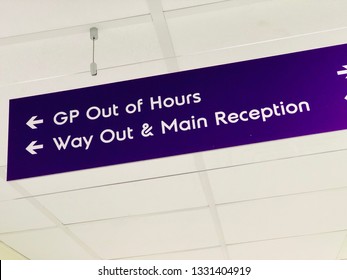 Sign For GP Out Of Hours, Way Out And Main Reception In An NHS Hospital, UK