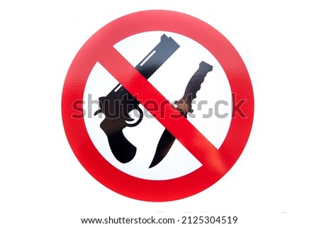 Sign graphically stating no guns or knives allowed