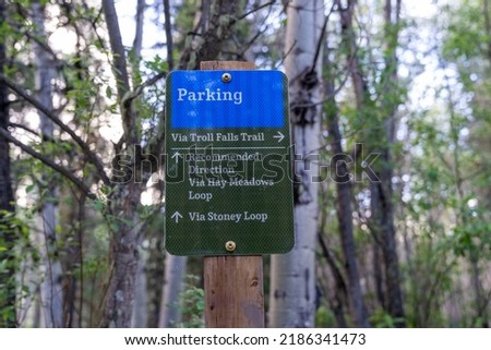 Sign for hikers with directions to Troll Falls, Hay Meadows and the Stoney Loop in Kananaskis Country Alberta Canada