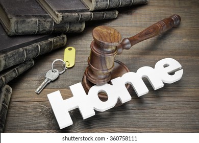 Sign Home, Door Key, Judges Or Auctioneer Gavel And Old Law Book On The Wood Table. Concept For Trial, Bankruptcy, Tax, Mortgage,  Auction Bidding, Foreclosure Or Inherit Real Estate