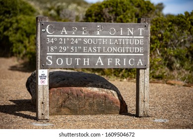 Sign indicating Cape Point with longitude e latitude near Cape Town, South Africa - Shutterstock ID 1609504672