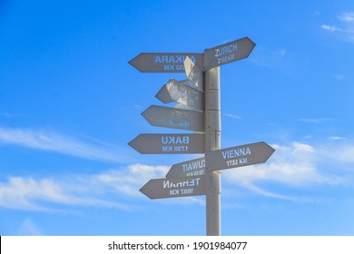 Sign Indicating The Directions And Distances To Major Cities In The World On Observation Deck On A Top Of Tahtali Mountain Near Kemer, Antalya Province In Turkey