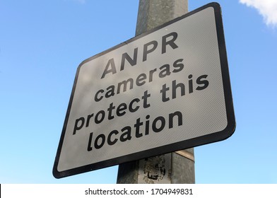Sign in an industrial area warning that Automatic Number Plate Recognition (ANPR) cameras are in use to protect this location.