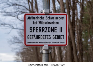 Sign With The Inscription African Swine Fever In Feral Pigs Restricted Zone II Endangered Area, Germany, 09.01.2022, Cottbus.