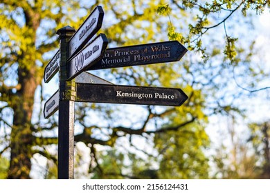 Sign in Kensington Gardens pointing to Kensington Palace in London, England, United Kingdom.