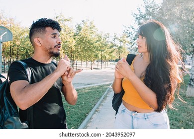 Sign Language: 2 Hispanic And African American Student Friends Deaf  Talking With Nonverbal Communication. Latinx Deafness Conversation.