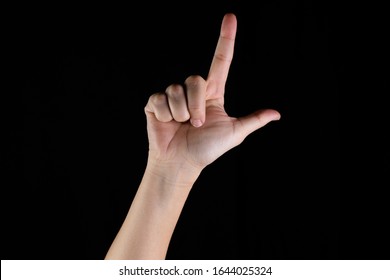 Sign Language With Hand On Black Background. Letter L