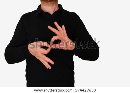 Sign language interpreter man translating a meeting to ASL, American Sign Language. Empty copy space for Editor's content.