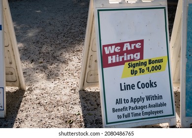 Sign At Local Restaurant During The Time Of Covid-19 Looking To Hire Staff With A Large Hiring Bonus.