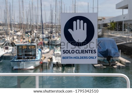 sign in marina dock for boats for customers only, Lanzarote Island