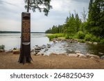 A sign marking the trail to the Mississippi Headwaters, guiding visitors to the source of this iconic river.