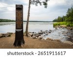A sign marking the trail to the Mississippi Headwaters, guiding visitors to the source of this iconic river.