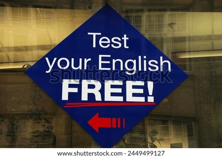 A sign offering a free English test reads, 