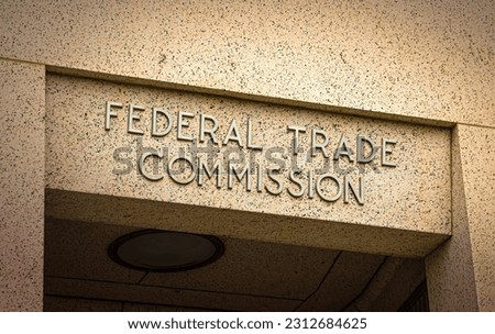 Sign on Doorway for the Federal Trade Commission in Washington D.C. in raised lettering.