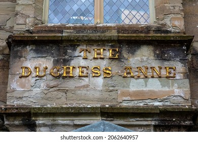 The sign on the facade of The Duchess Anne in the town of Dunkeld in Scotland, UK.  The building was once a Girls School, but now serves as a hall for the local community. - Shutterstock ID 2062640957