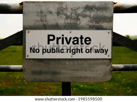 A sign on a gate says “Private No public right of way”, forbidding walkers and members of the public entry to the land.