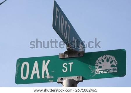 Sign on the intersection or corner of First street and Oak street in Greenville