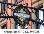 A sign on Mathew Street, located in the historic Cavern Quarter of Liverpool, UK.