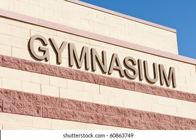 Sign On The Outside Of A School  Gymnasium Building.