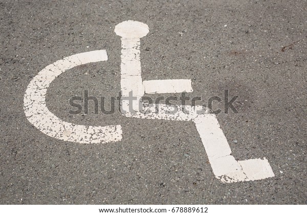 Sign for\
parking space reserved for disabled\
people