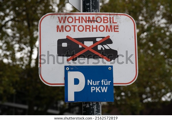 Sign at a parking lot that says\
in German that only cars are allowed to park but no mobile\
homes