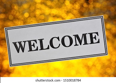 Sign plate - welcome to the background of bokeh lights. Message-informational invitation, permission, greeting card. Bokeh lights-wonderful light sparks holiday. 