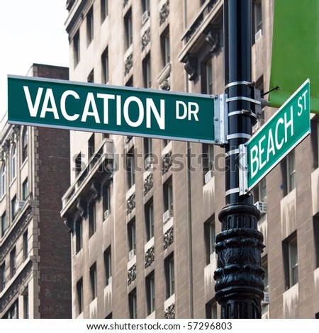 A sign post at the intersection of two streets reading VACATION DR and BEACH ST.  Remove the words and insert your own to easily customize the message.