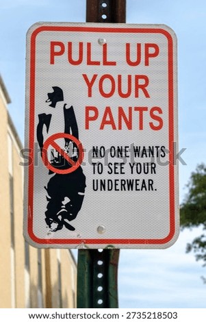 Sign printed with pull up your pants