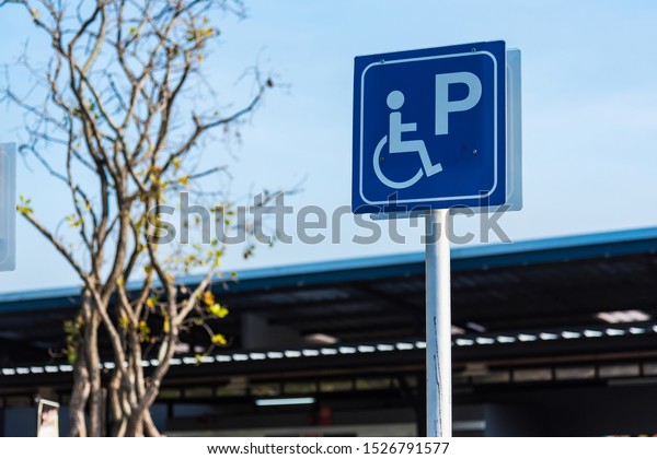 Sign public concept, disabled people parking car\
sign on pump oil fuel\
service