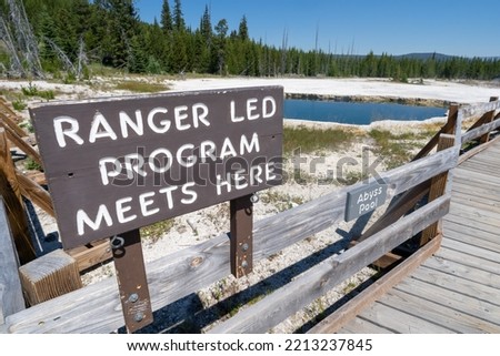 Sign - Ranger-led program meets here, in front of Abyss Pool, for tours and guides of West Thumb Geyser Basin in Yellowstone National Park