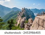 a sign reading "Climbing the summit of Ulsan", spectacular view from the top of Ulsanbawi Rock in Seoraksan National Park, South Korea