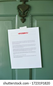 Sign Reading Overdue Is Taped To A Front Door - Late Bills - Rent - Mortgage - Loan 