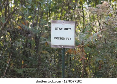 sign reading stay out poison ivy
