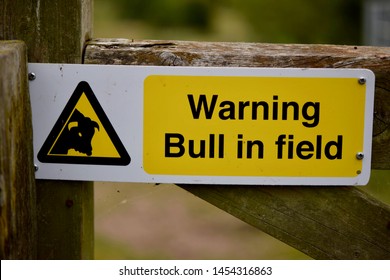 Sign reading 'Warning/ Bull in field'
