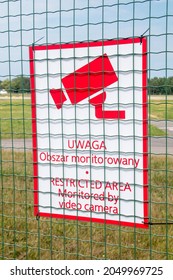 Sign Restricted Area Monitored By Video Camera.