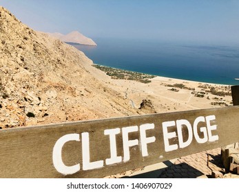 Sign in the rugged mountain of Zighy Bay in Oman