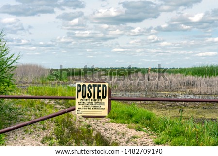 Similar – Image, Stock Photo Wide land | Say it through the flower | Male portrait with blurred flowers in foreground