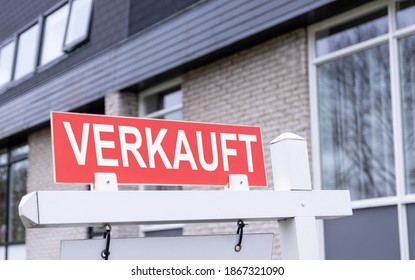 Sign Saying That The House Has Been Sold. German Estate Agent Sign.